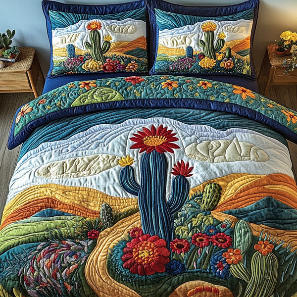 Desert Dreams quilted 3-piece bedding set on a made bed with two matching pillow shams