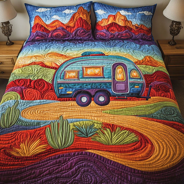Desert Drift quilted 3-piece bedding set on a made bed with two matching pillow shams