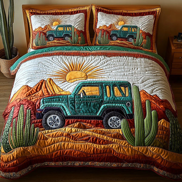 Desert Drift quilted 3-piece bedding set on a made bed with two matching pillow shams