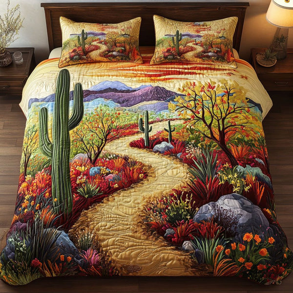 Desert Flora Journey quilted 3-piece bedding set on a made bed with two matching pillow shams