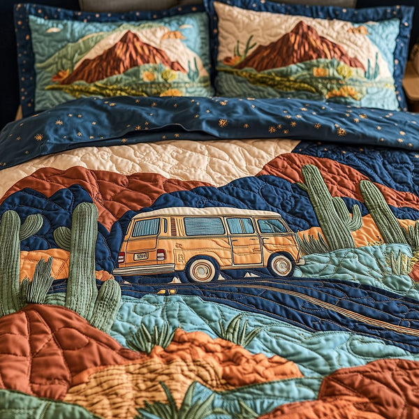 Desert Highway quilted 3-piece bedding set on a made bed with two matching pillow shams