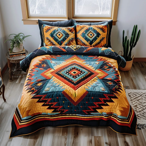 Desert Mirage quilted 3-piece bedding set on a made bed with two matching pillow shams