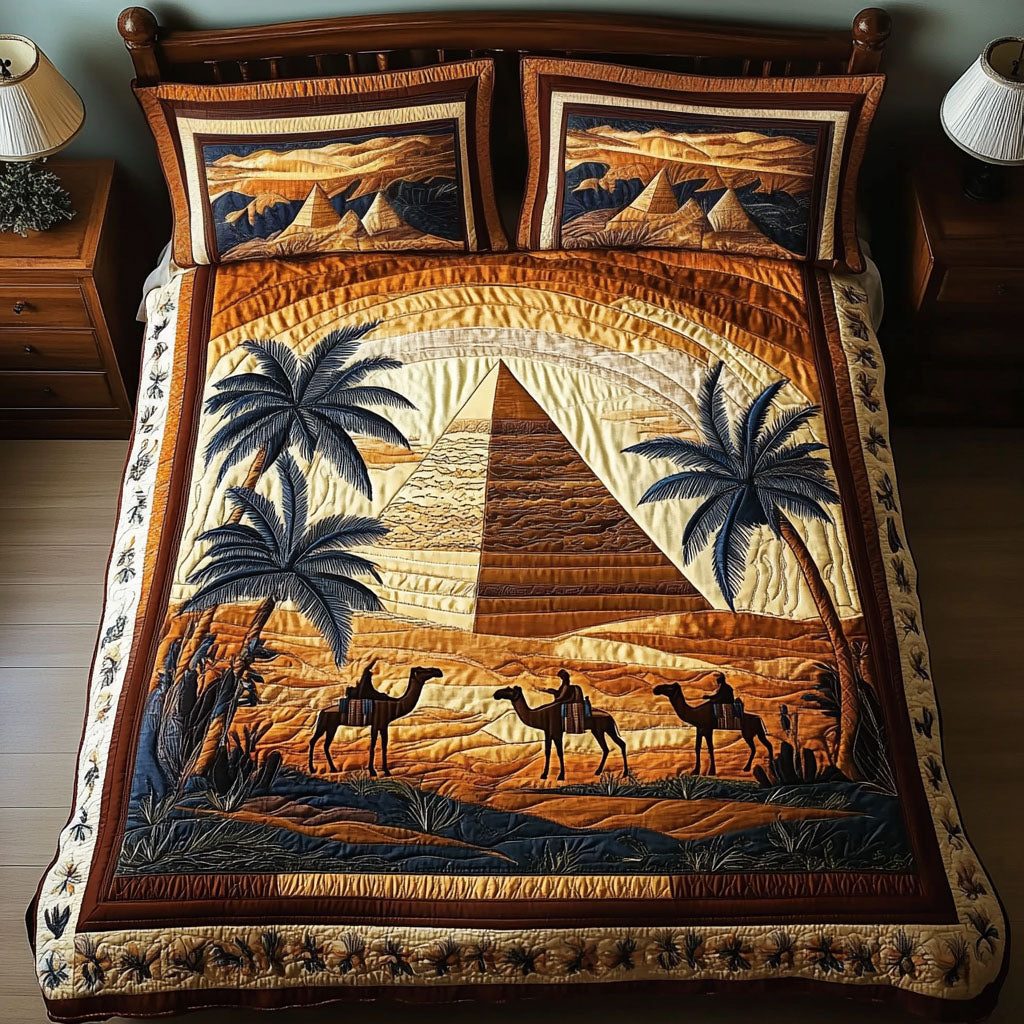 Desert Pyramid Dream quilted 3-piece bedding set on a made bed with two matching pillow shams
