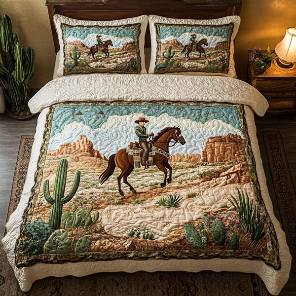 Desert Ride quilted 3-piece bedding set on a made bed with two matching pillow shams