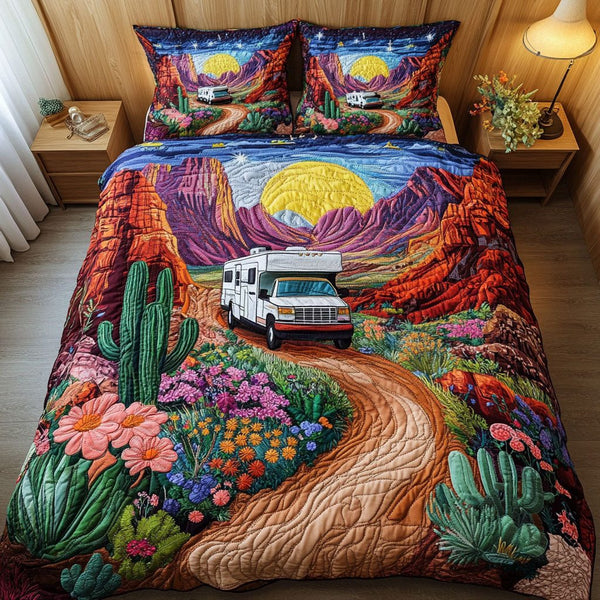 Desert Road Trip quilted 3-piece bedding set on a made bed with two matching pillow shams