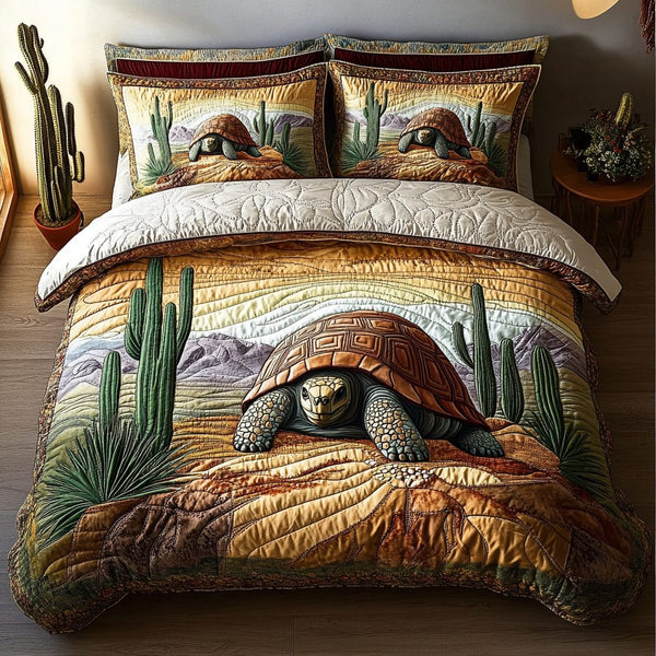 Desert Wanderer quilted 3-piece bedding set on a made bed with two matching pillow shams