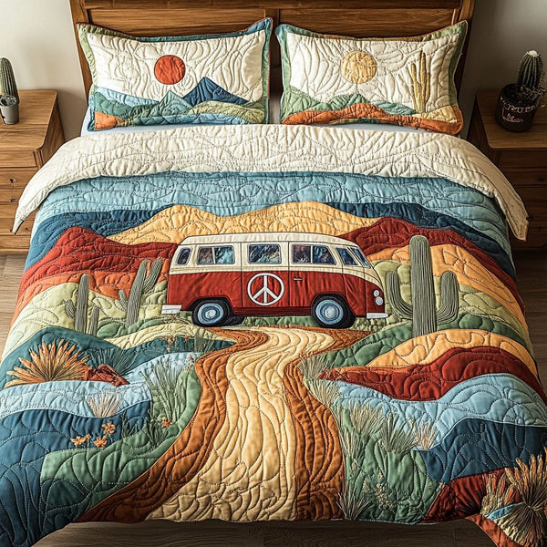 Desert Wanderer quilted 3-piece bedding set on a made bed with two matching pillow shams