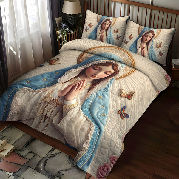 Divine Grace quilted 3-piece bedding set on a made bed in a softly lit bedroom