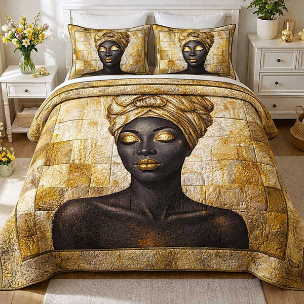 Divine Queen quilted 3-piece bedding set on a made bed in a softly lit bedroom