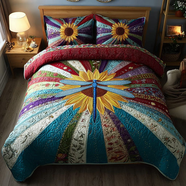 Dragonfly Beauty quilted 3-piece bedding set on a made bed with two matching pillow shams