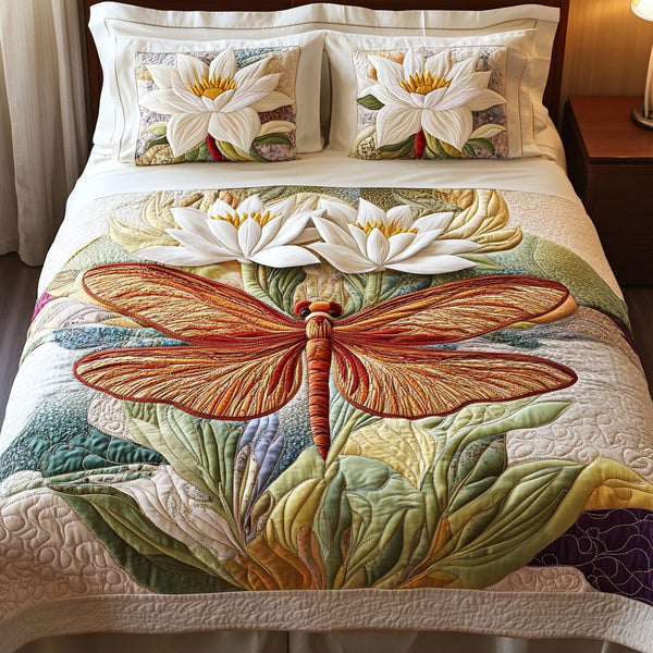 Dragonfly Bliss quilted 3-piece bedding set on a made bed with two matching pillow shams