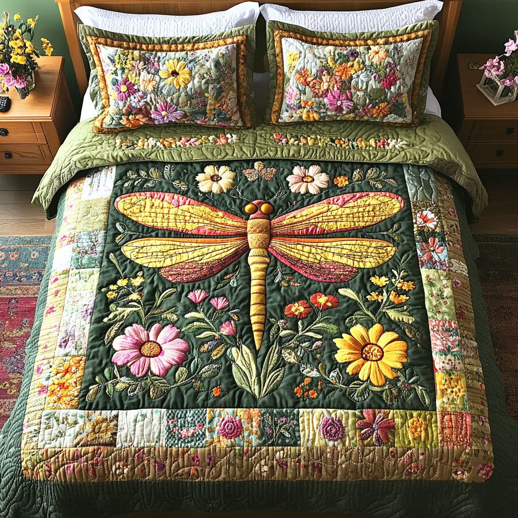 Dragonfly Blossom quilted 3-piece bedding set on a made bed with two matching pillow shams