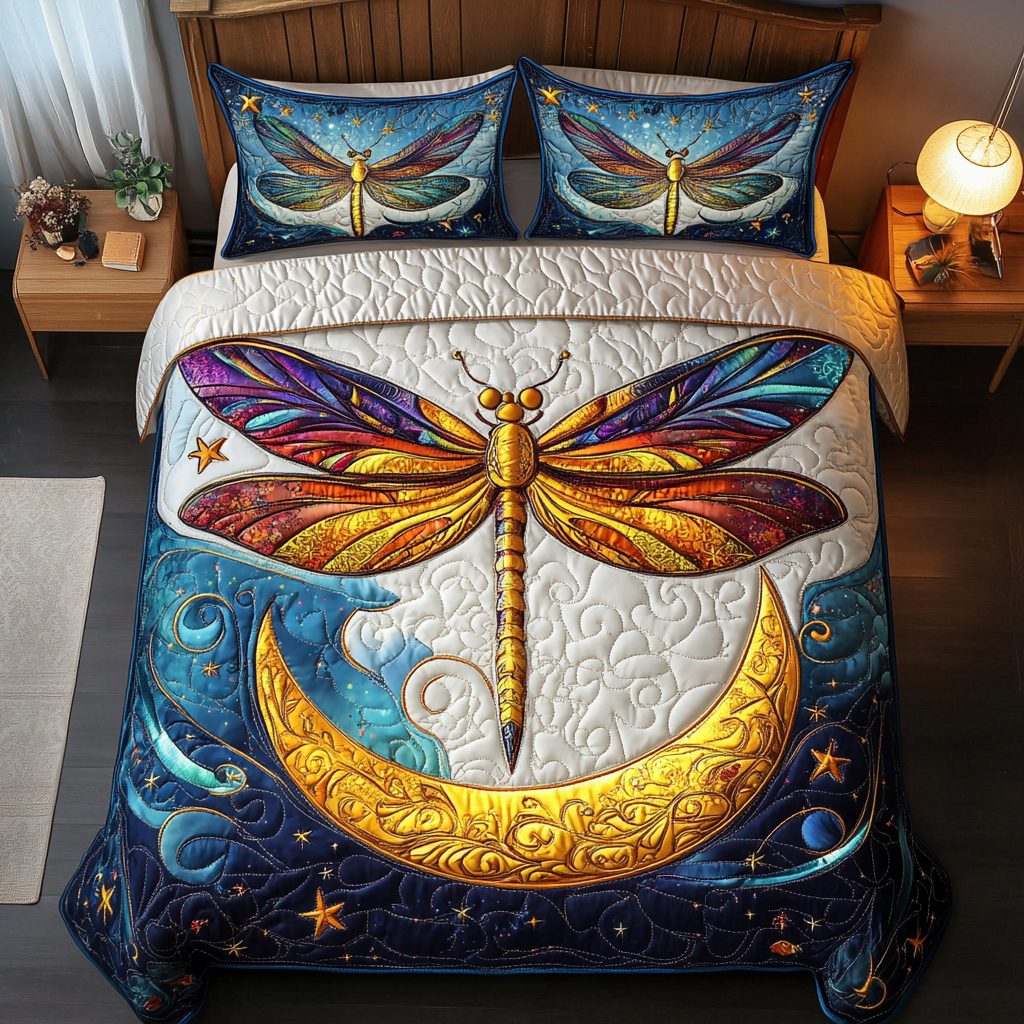 Dragonfly Breeze quilted 3-piece bedding set on a made bed with two matching pillow shams