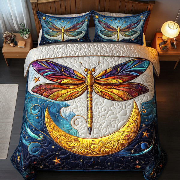 Dragonfly Breeze quilted 3-piece bedding set on a made bed with two matching pillow shams