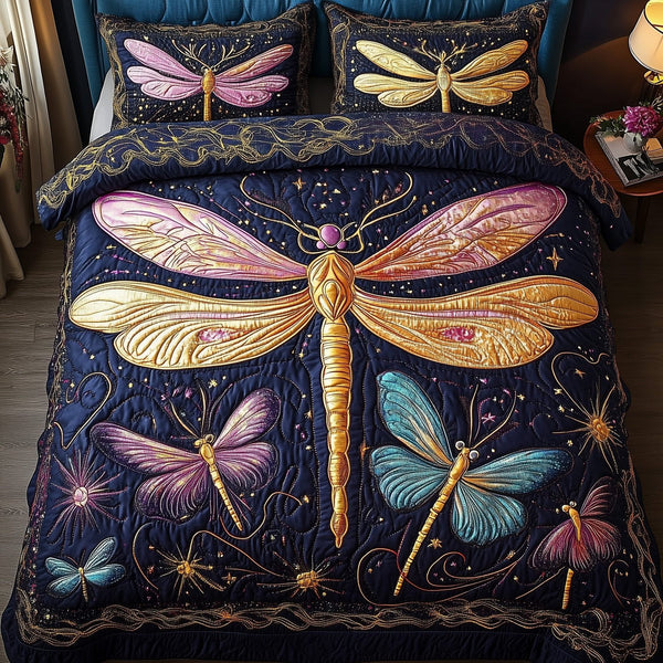 Dragonfly Dream quilted 3-piece bedding set on a made bed with two matching pillow shams