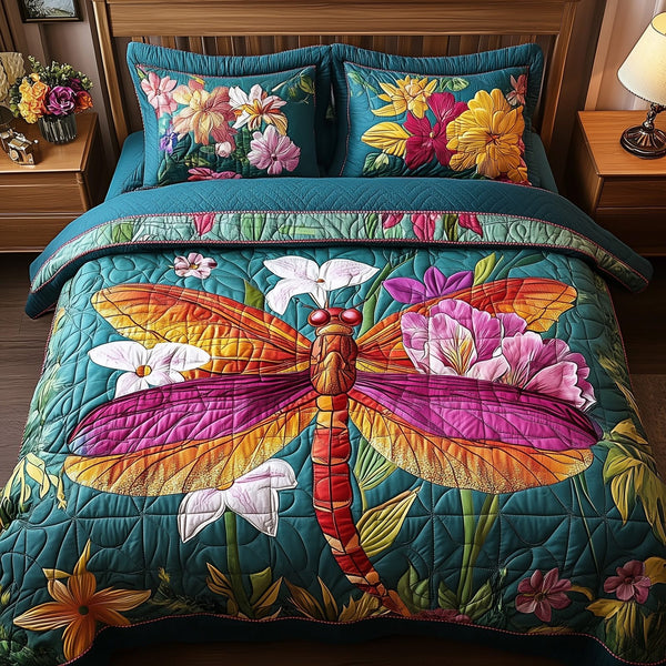 Dragonfly Dream quilted 3-piece bedding set on a made bed with two matching pillow shams