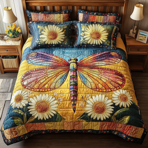Dragonfly Dream quilted 3-piece bedding set on a made bed with two matching pillow shams