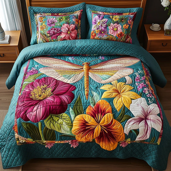 Dragonfly Dream quilted 3-piece bedding set on a made bed with two matching pillow shams
