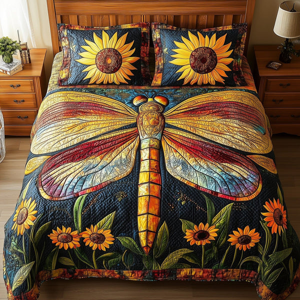 Dragonfly Dream quilted 3-piece bedding set on a made bed with two matching pillow shams