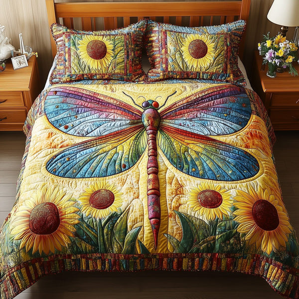 Dragonfly Dream quilted 3-piece bedding set on a made bed with two matching pillow shams