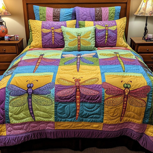Dragonfly Dream quilted 3-piece bedding set on a made bed with two matching pillow shams