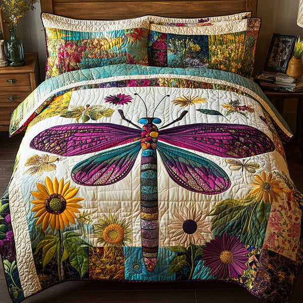 Dragonfly Dream quilted 3-piece bedding set on a made bed with two matching pillow shams
