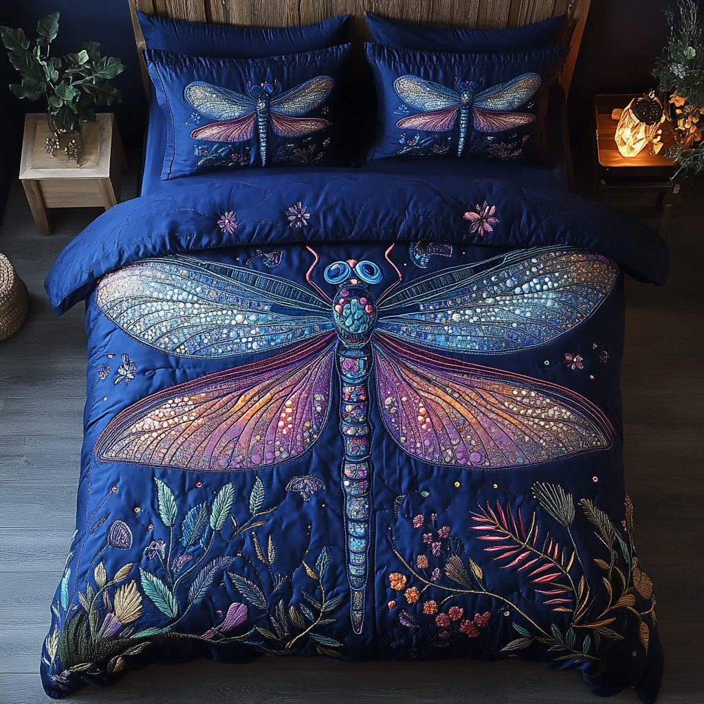 Dragonfly Dreams quilted 3-piece bedding set on a made bed with two matching pillow shams