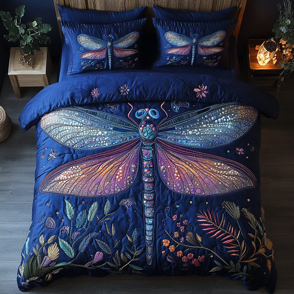 Dragonfly Dreams quilted 3-piece bedding set on a made bed with two matching pillow shams