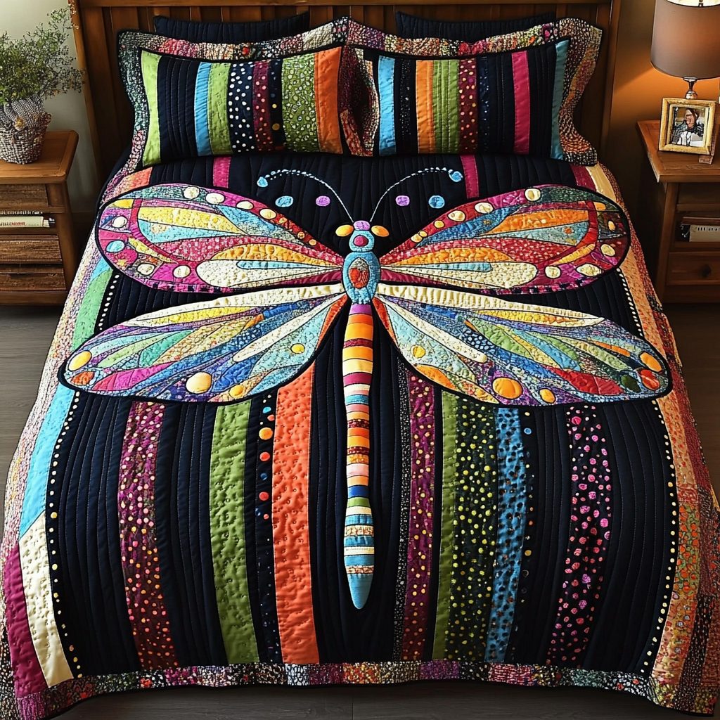 Dragonfly Dreams quilted 3-piece bedding set on a made bed with two matching pillow shams