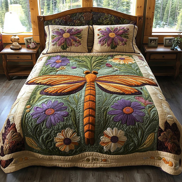 Dragonfly Dreams quilted 3-piece bedding set on a made bed with two matching pillow shams
