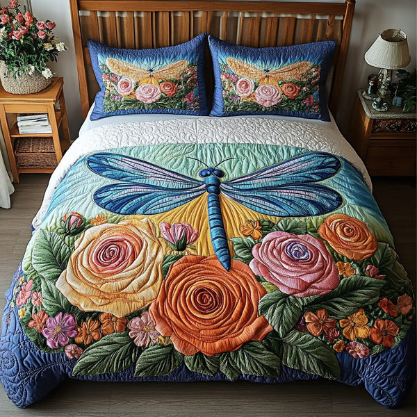 Dragonfly Dreams quilted 3-piece bedding set on a made bed with two matching pillow shams