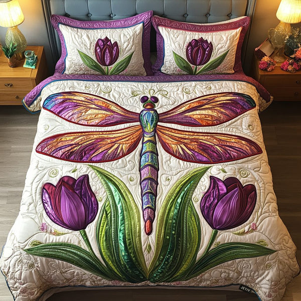 Dragonfly Dreamscape quilted 3-piece bedding set on a made bed with two matching pillow shams