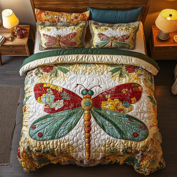 Dragonfly Dreamscape quilted 3-piece bedding set on a made bed with two matching pillow shams