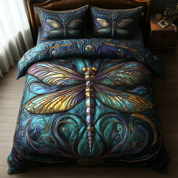Dragonfly Escape quilted 3-piece bedding set on a made bed with two matching pillow shams