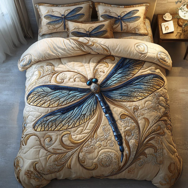 Dragonfly Flight quilted 3-piece bedding set on a made bed with two matching pillow shams