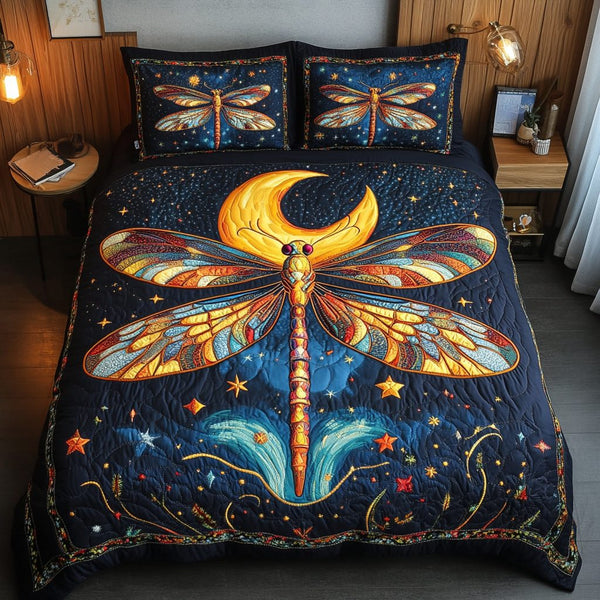 Dragonfly Flight quilted 3-piece bedding set on a made bed with two matching pillow shams