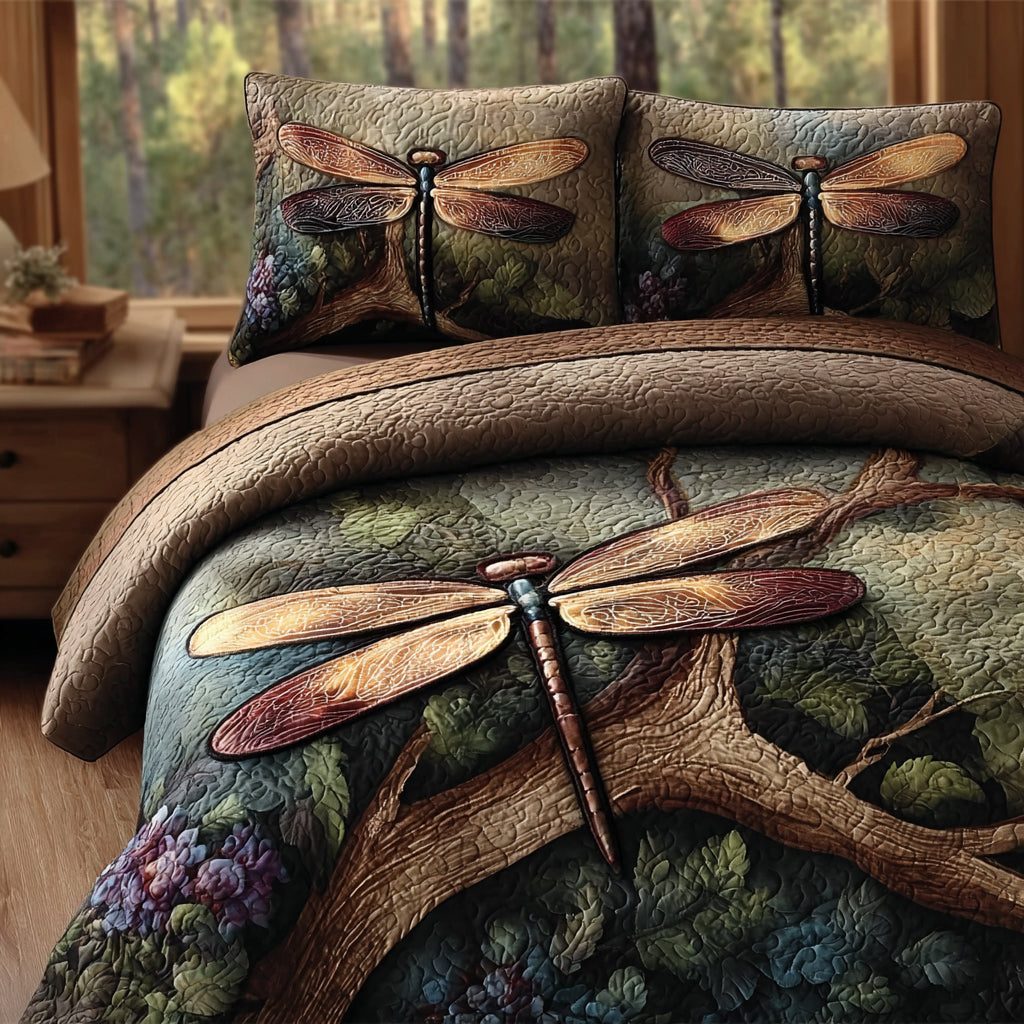 Dragonfly Garden quilted 3-piece bedding set on a made bed with two matching pillow shams