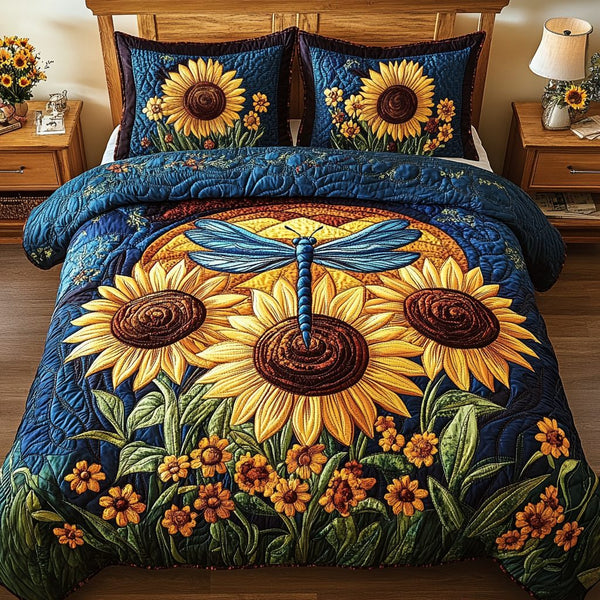 Dragonfly Garden quilted 3-piece bedding set on a made bed with two matching pillow shams