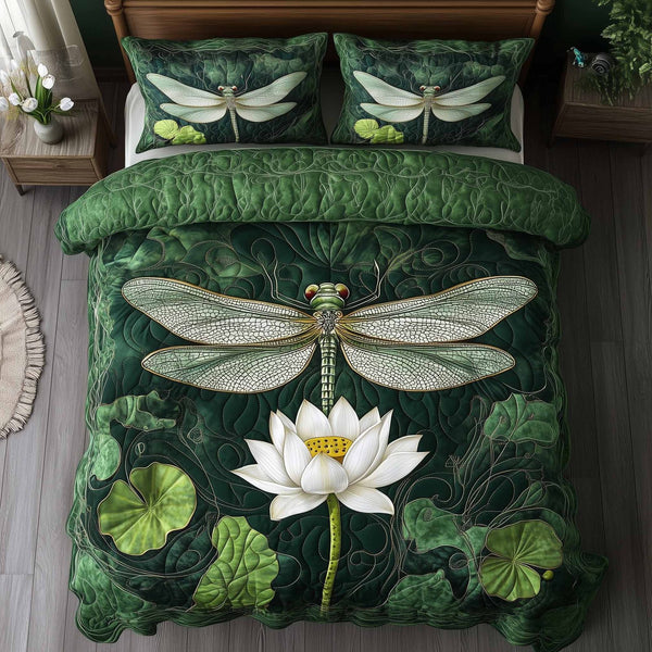 Dragonfly Glow quilted 3-piece bedding set on a made bed with two matching pillow shams
