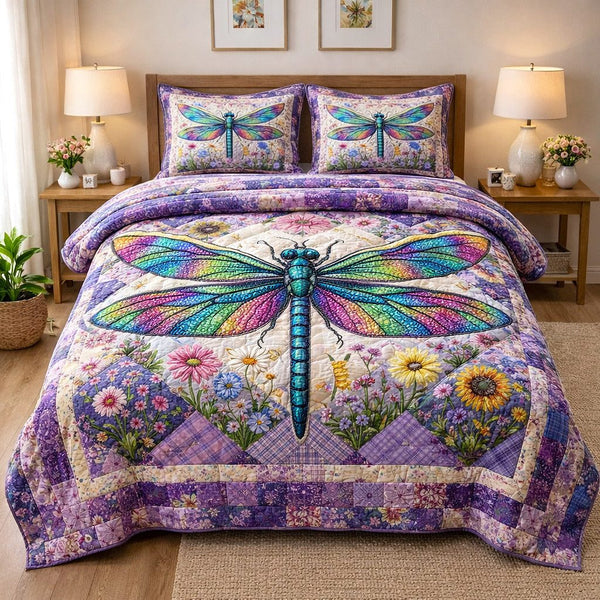 Dragonfly Glow quilted 3-piece bedding set on a made bed with two matching pillow shams