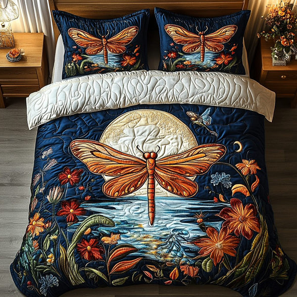 Dragonfly Harmony quilted 3-piece bedding set on a made bed with two matching pillow shams