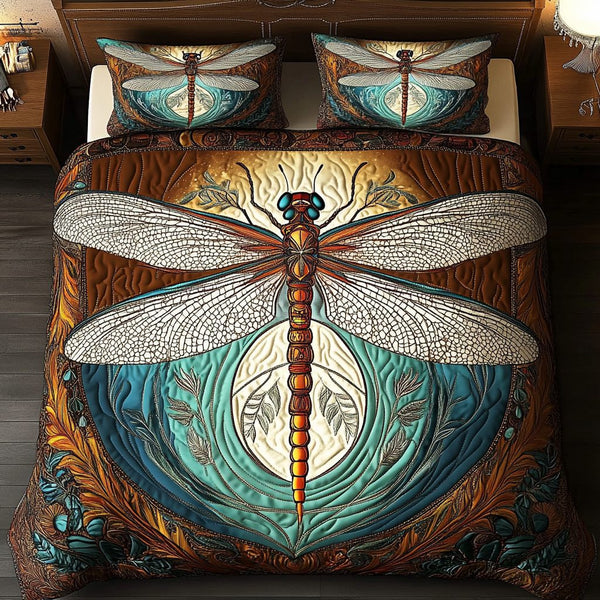 Dragonfly Harmony quilted 3-piece bedding set on a made bed with two matching pillow shams