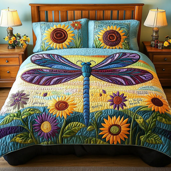 Dragonfly Haven quilted 3-piece bedding set on a made bed with two matching pillow shams