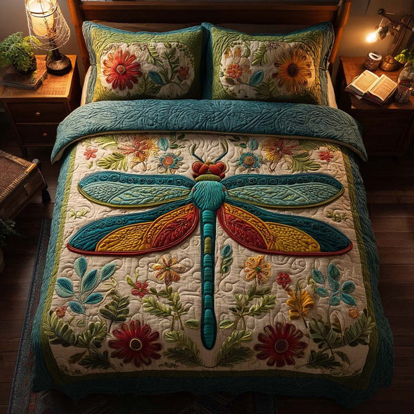 Dragonfly Haven quilted 3-piece bedding set on a made bed with two matching pillow shams