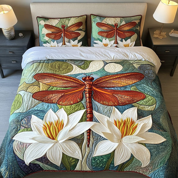 Dragonfly Haven quilted 3-piece bedding set on a made bed with two matching pillow shams
