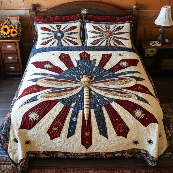 Dragonfly of Freedom quilted 3-piece bedding set on a made bed in a warmly lit bedroom