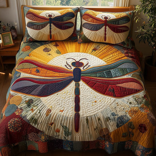 Dragonfly Paradise quilted 3-piece bedding set on a made bed with two matching pillow shams