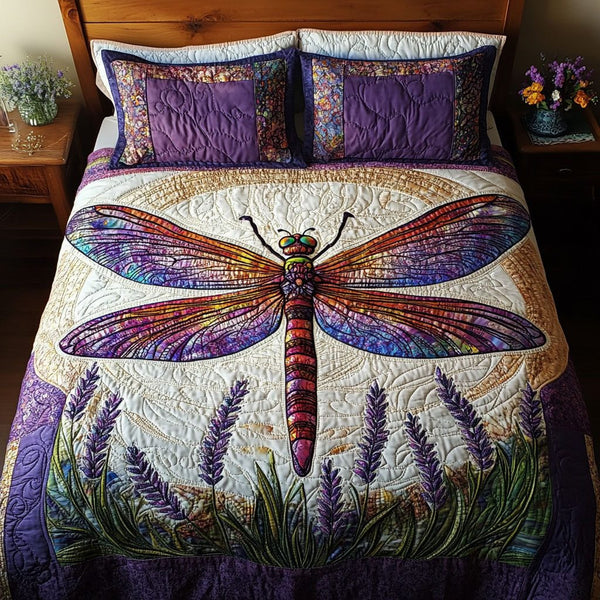 Dragonfly Serenity Bloom quilted 3-piece bedding set on a made bed with two matching pillow shams
