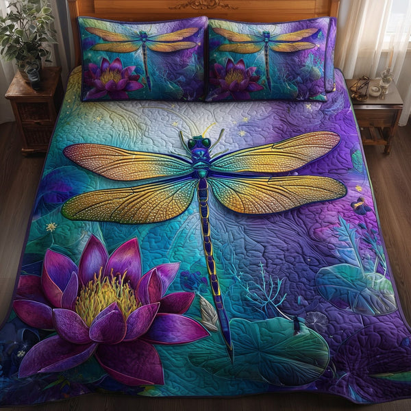 Dragonfly Serenity quilted 3-piece bedding set on a made bed with two matching pillow shams