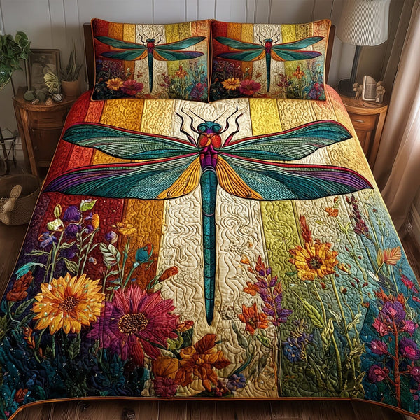 Dragonfly Serenity quilted 3-piece bedding set on a made bed with two matching pillow shams
